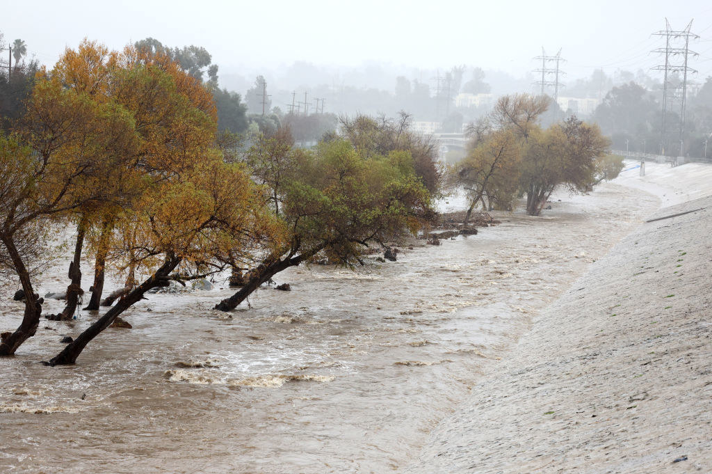 Rain falls as the Los Angeles River flows at a strong rate on January 09, 2023 in Los Angeles, California. 