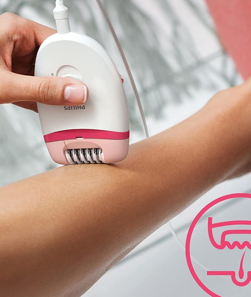 A person using the epilator on their arm