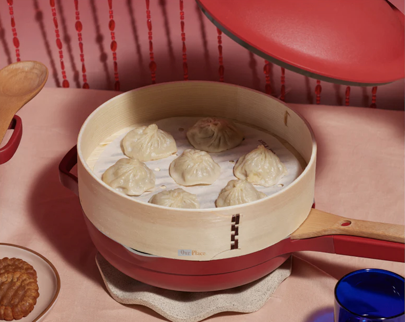 the pan with the basket steamer and dumplings inside