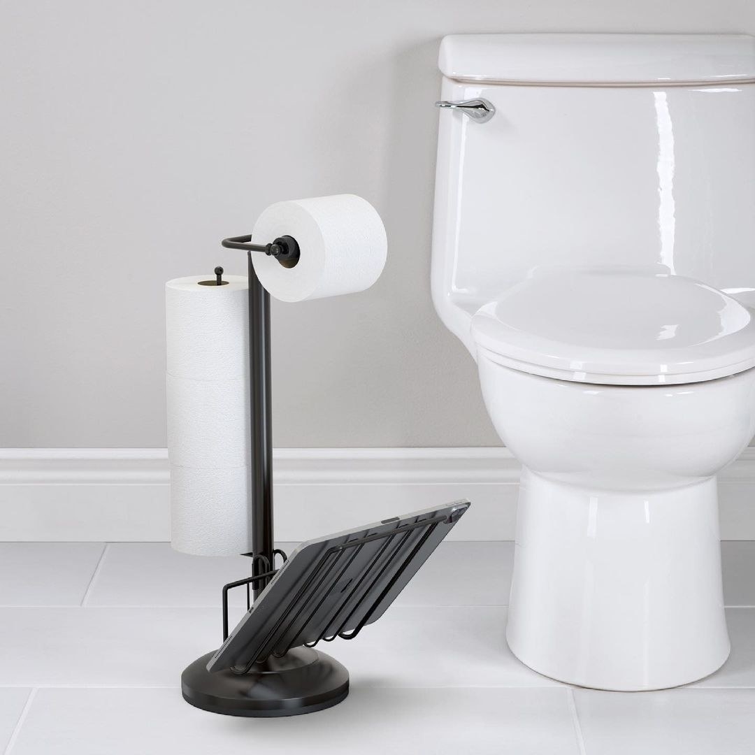 a 3 in 1 toilet stand with toilet paper and a magazine rack at the base