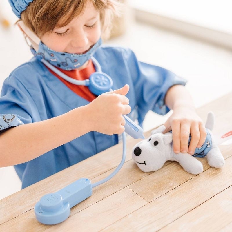 a child plays with the vet kit