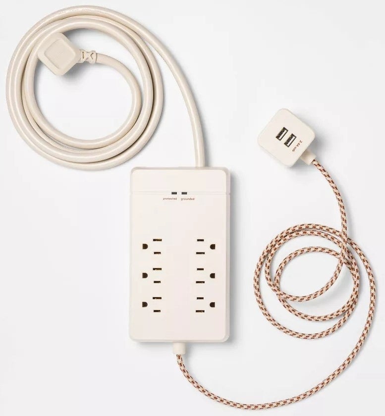The stone white surge protector against a white background