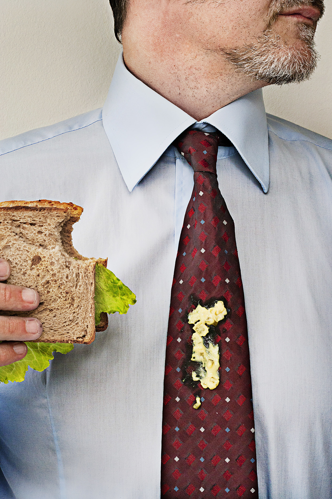 a man with food on his tie