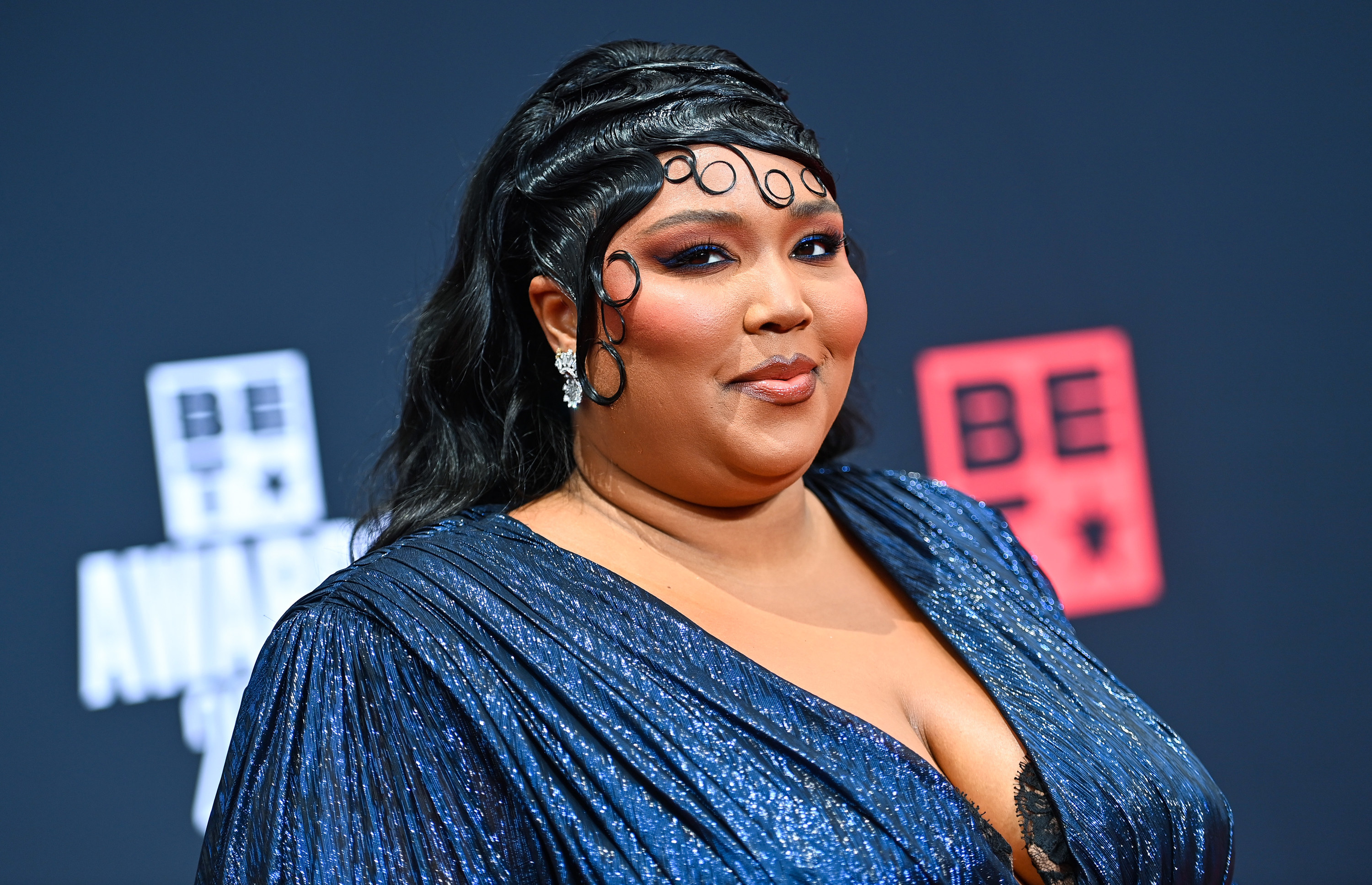 Lizzo calls herself the hero as she stuns in a new fantasy look