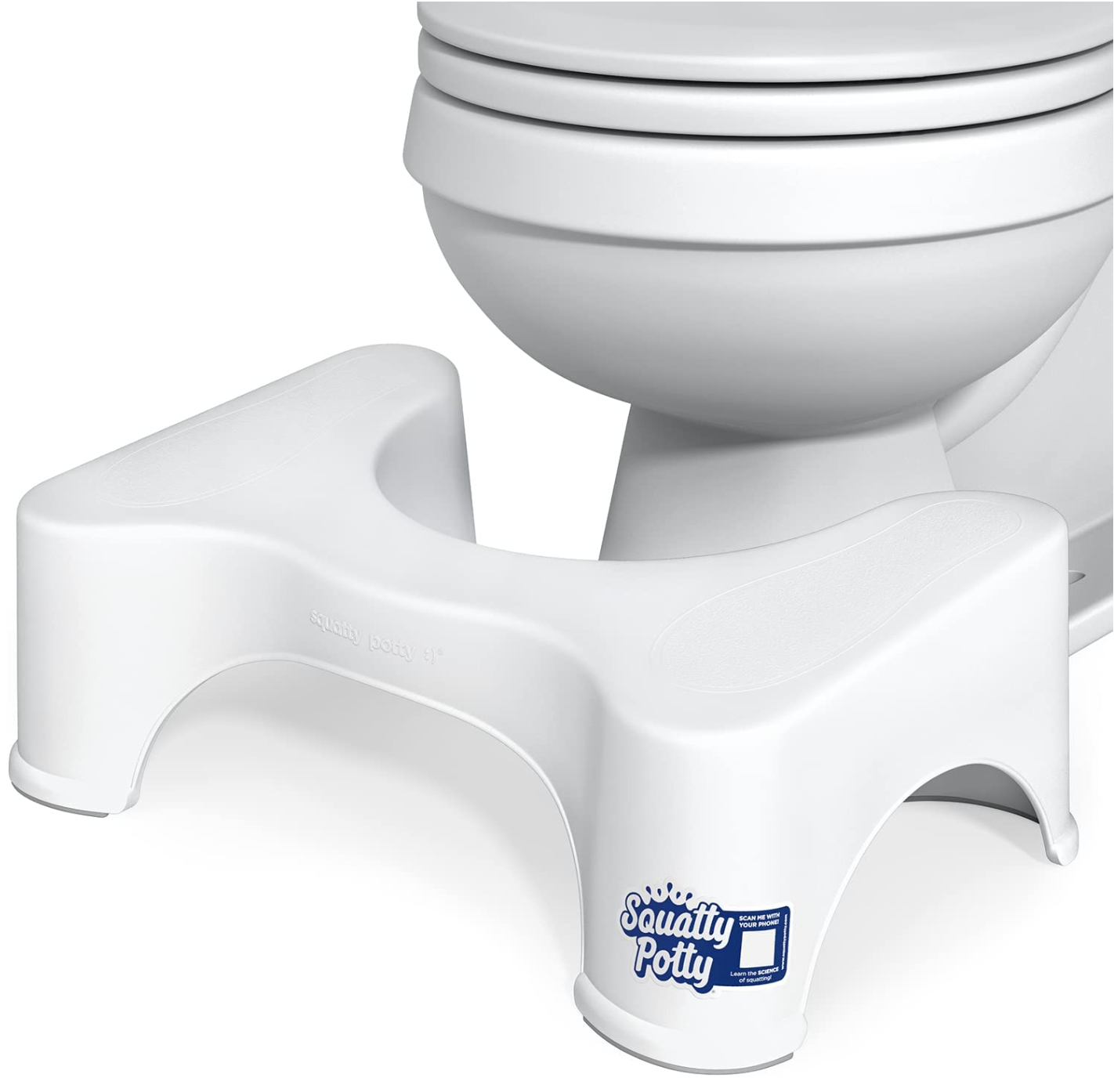 the squatty potty sitting in front of a toilet