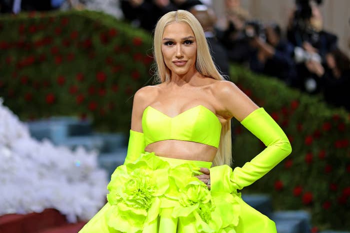 Gwen poses at the MET Gala in a bandeau top, flared floor-length skirt and matching gloves