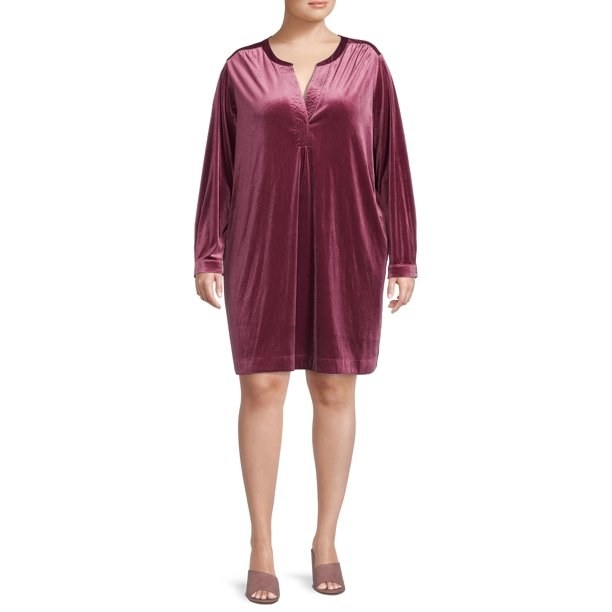 Model wearing velvet tunic dress in mauve