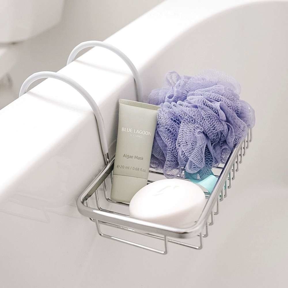 the tub caddy with soap, a mask, and a loofah