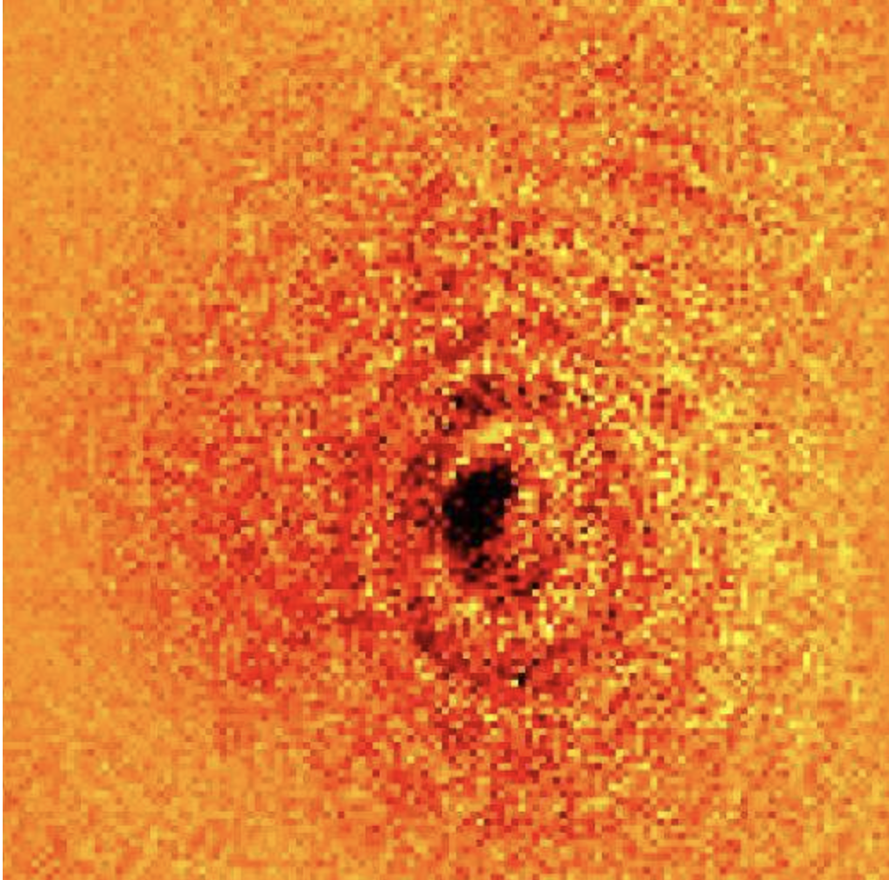 Pixelated orangey spirals with a small darker core