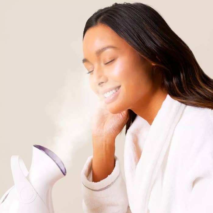 Person using a facial steamer