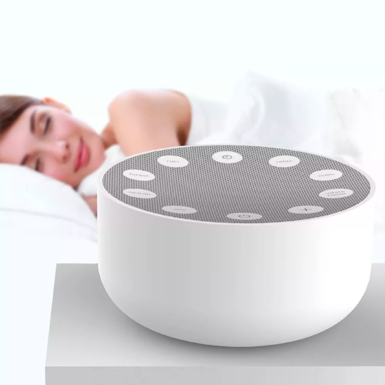 Sound machine and person sleeping behind it