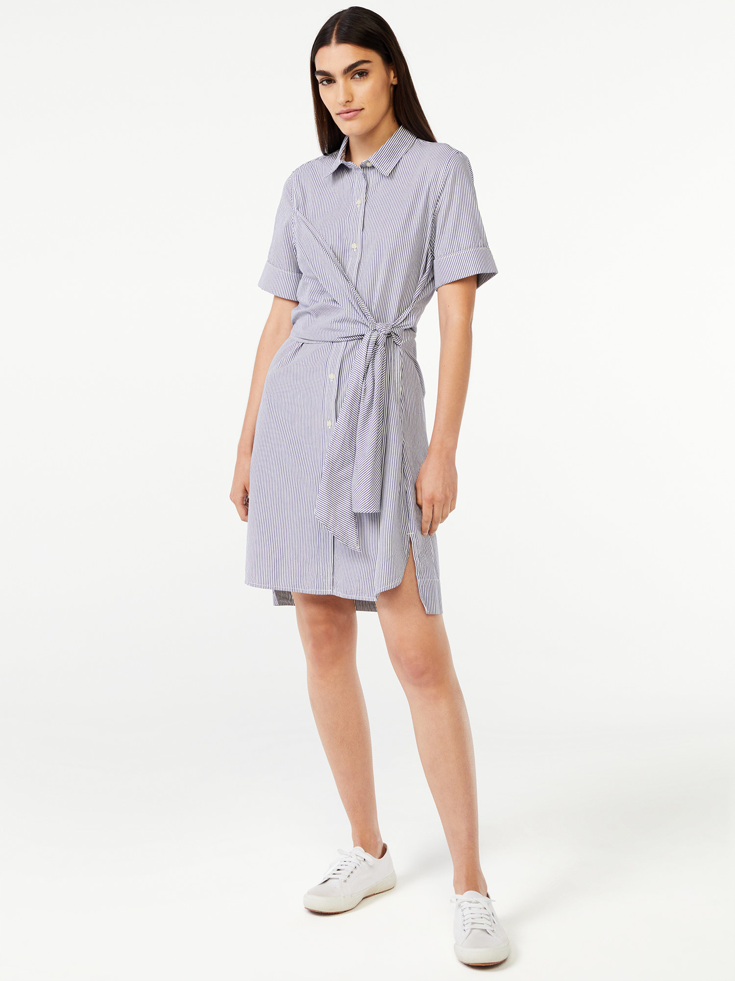 Model wearing short sleeve navy and white pin striped t shirt wrap dress with sneakers