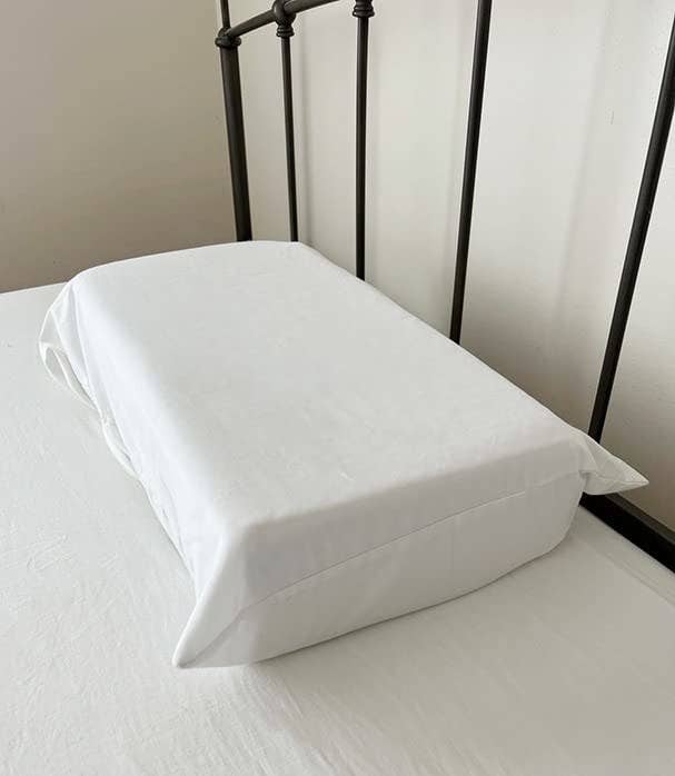 the pillow cube on a reviewer&#x27;s bed