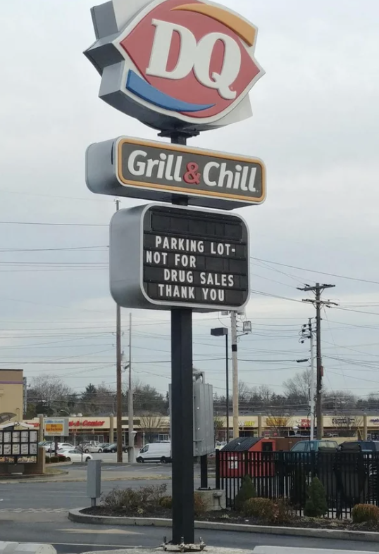 The marquee sign in front of a Dairy Queen says &quot;parking lot not for drug sales, thank you&quot;