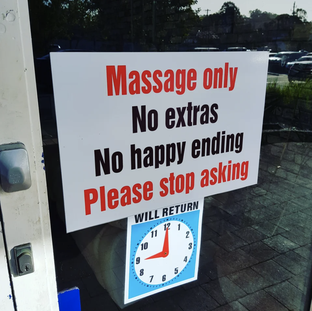 A sign says &quot;massage only, no extras, no happy ending, please stop asking&quot;