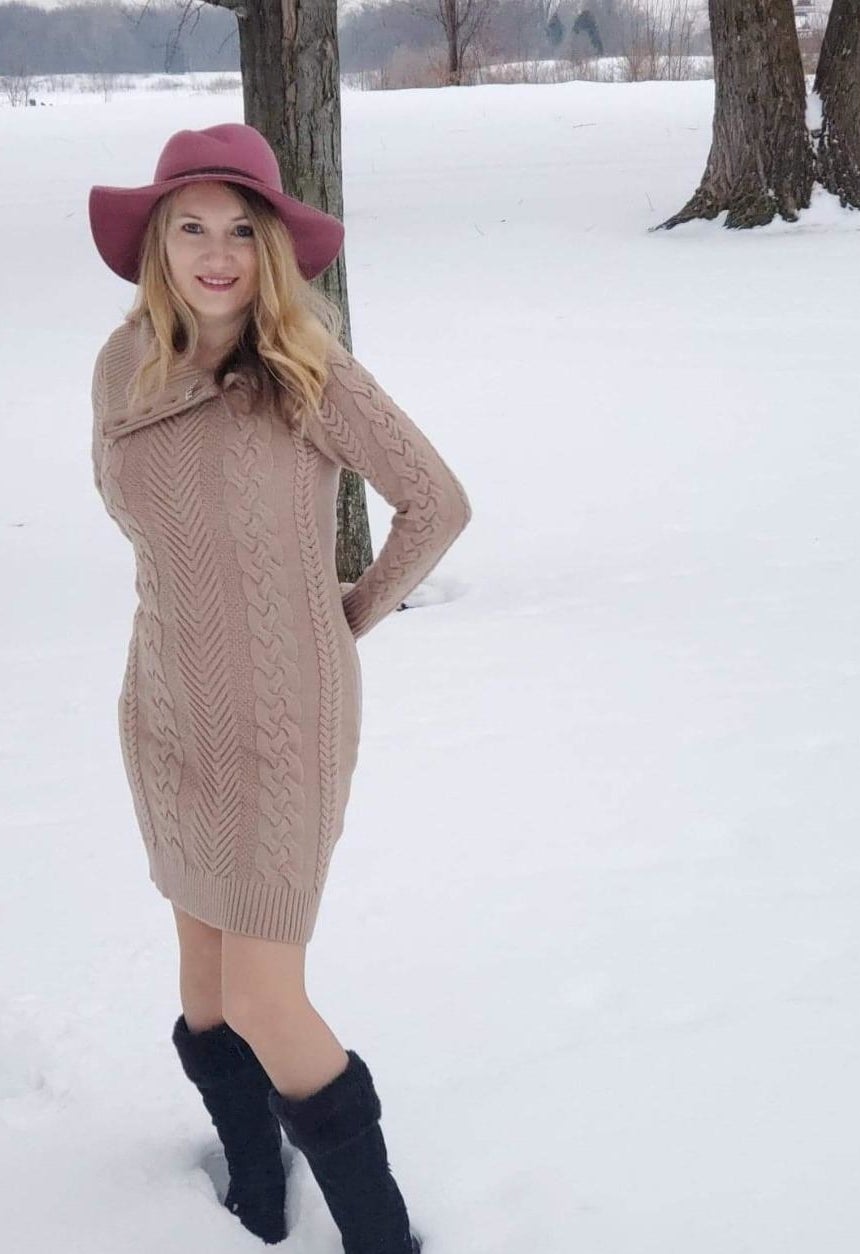 reviewer wearing beige cable knit sweater dress