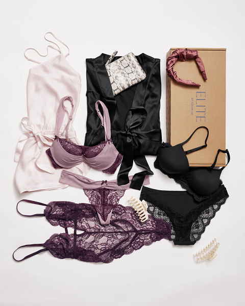 adore me elite box filled with purple and black lace lingerie sets