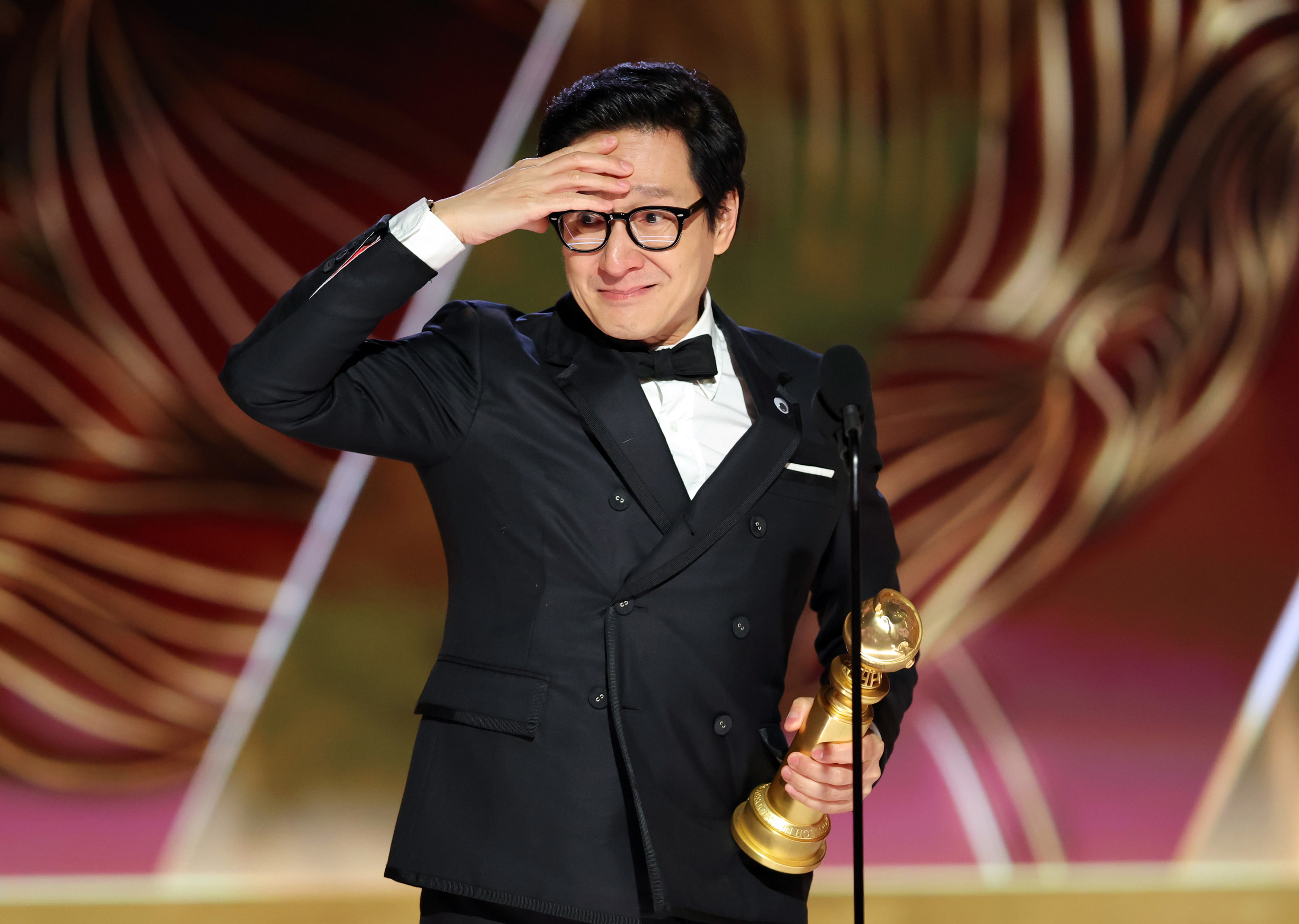 An emotional Ke Huy Quan giving his acceptance speech