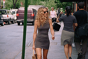 Carrie Bradshaw walking on the street.