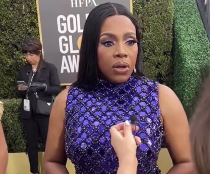 Sheryl on the carpet looking slightly in awe of the question
