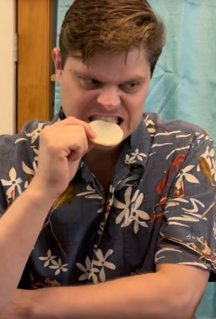 zach making a disgusted face with taking a bite