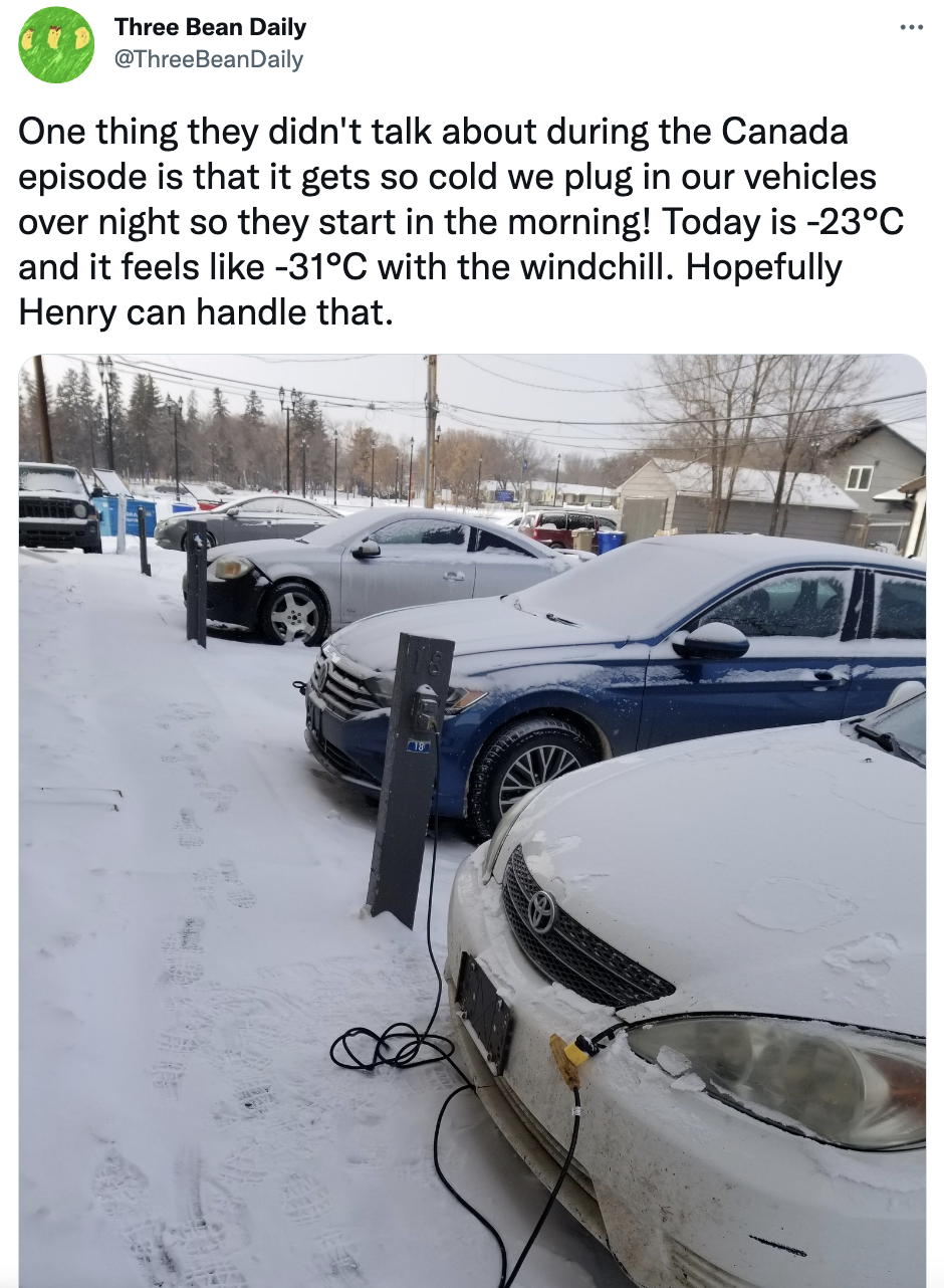 Cars charging in the snow