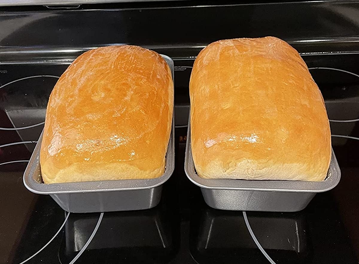 Reviewer image of baked bread in two loaf tins on a stove