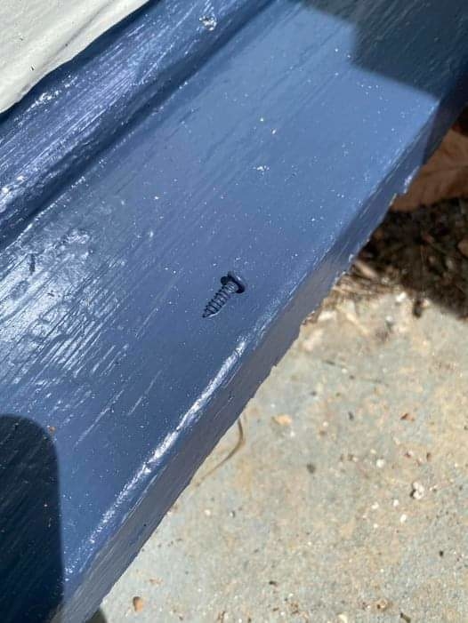 screw on a raised surface that has been painted over by a landlord