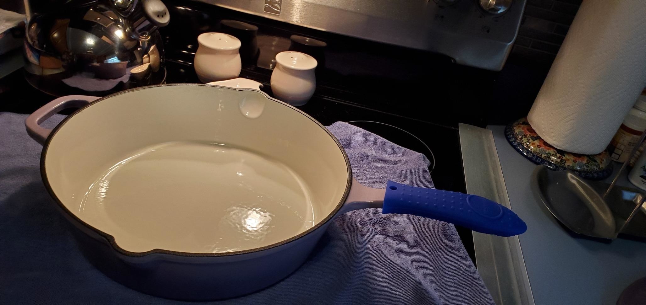 Reviewer image of blue silicone cover on a pan handle