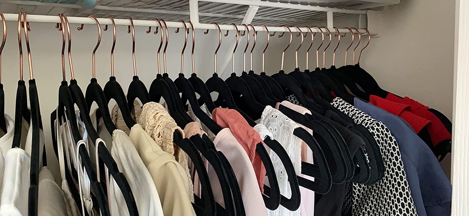 Reviewer image of black hangers in their closet