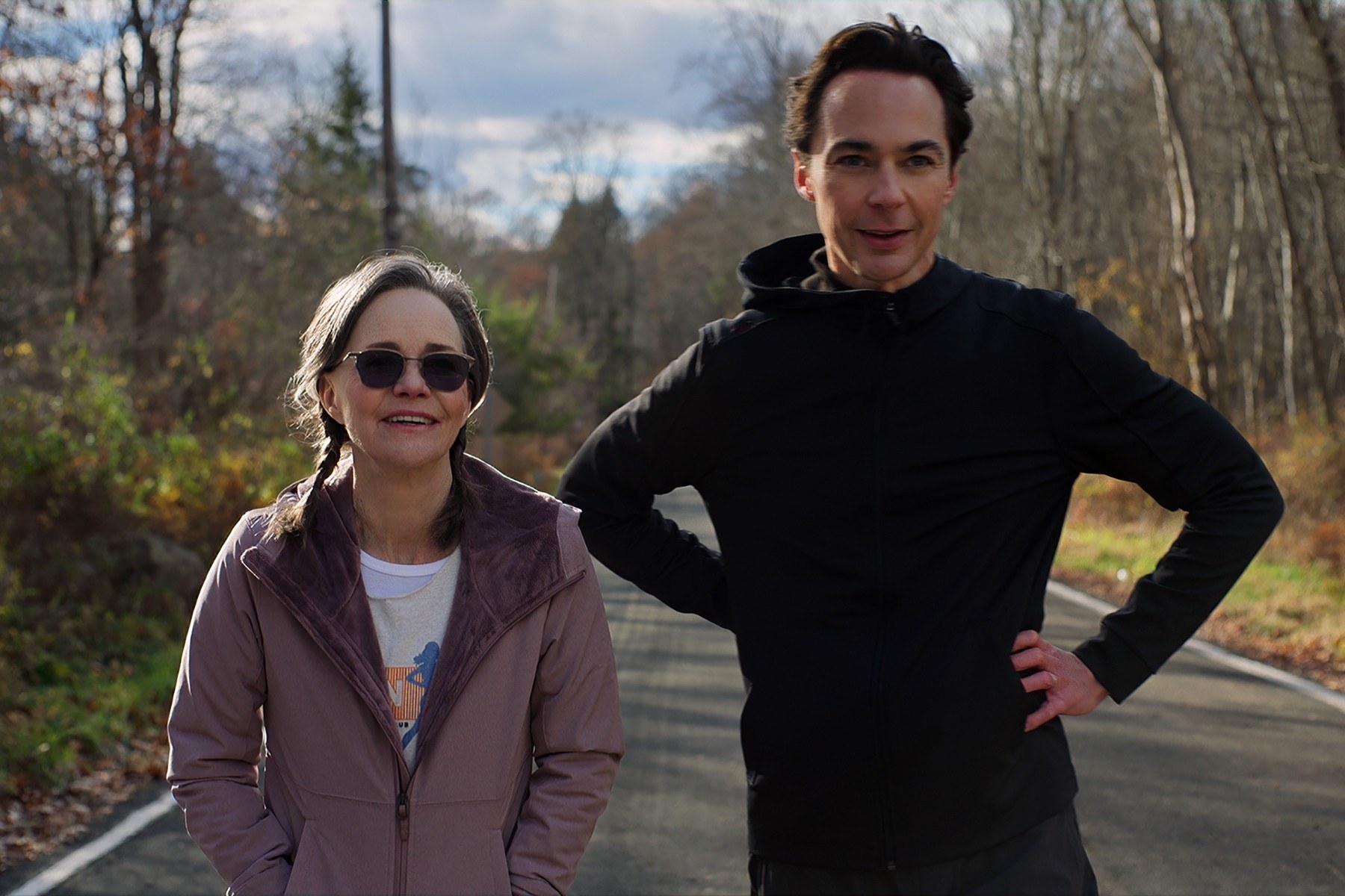 Sally Field and Jim Parsons stand on a road