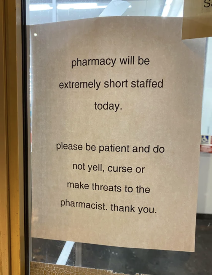 The sign says &quot;Pharmacy will be short staffed today, please be patient and do not yell, curse, or make threats to the pharmacist&quot;