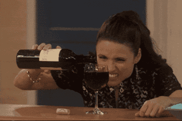 Elaine from Seinfeld pouring wine to the top of the glass