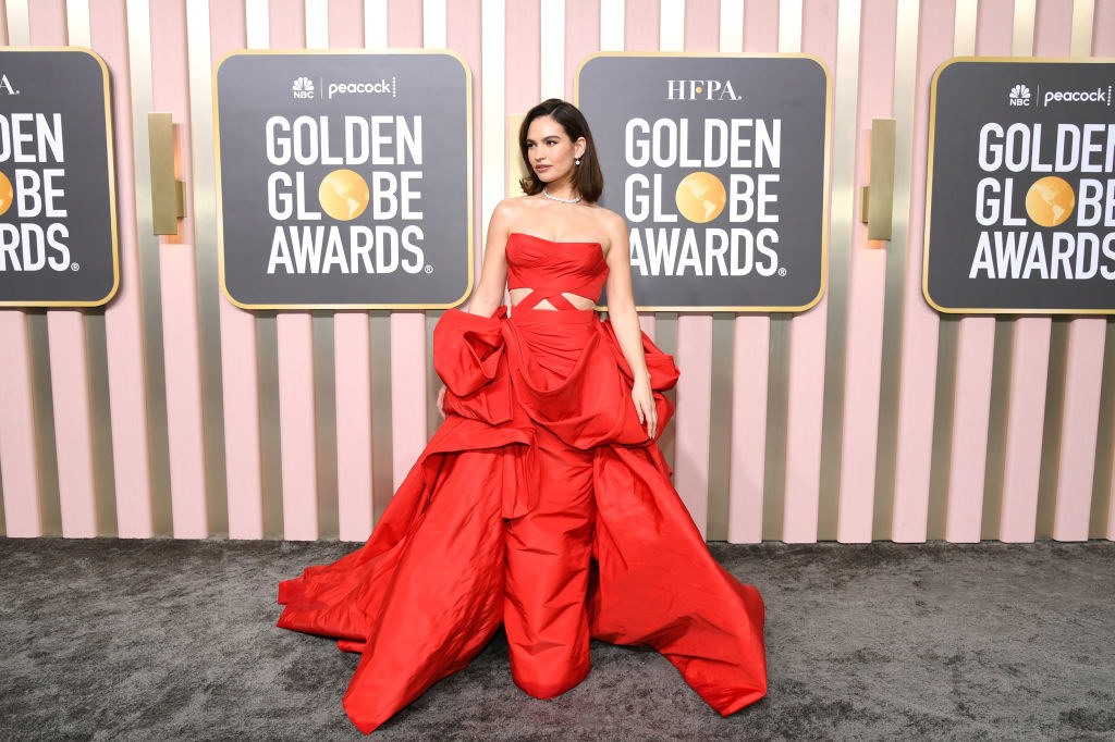 Lily James attends the 80th Annual Golden Globe Awards in a long gown