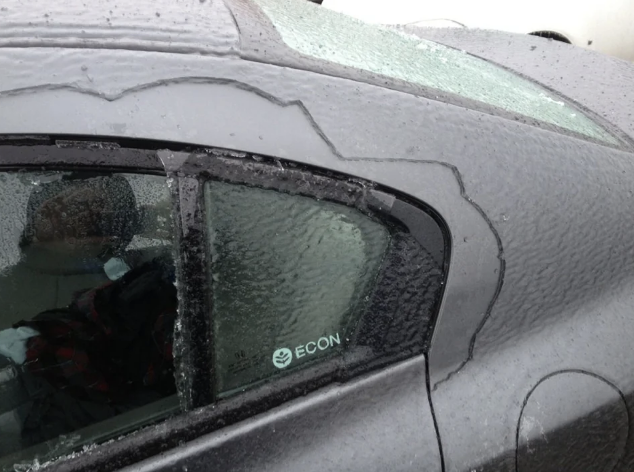 A car covered in frozen rain