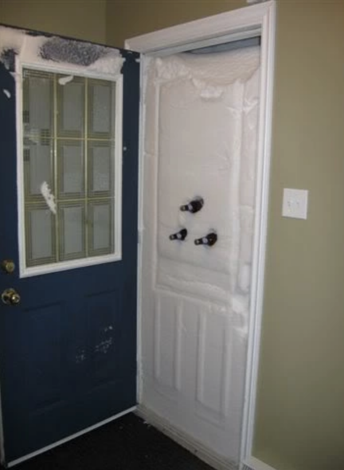A doorway covered in snow