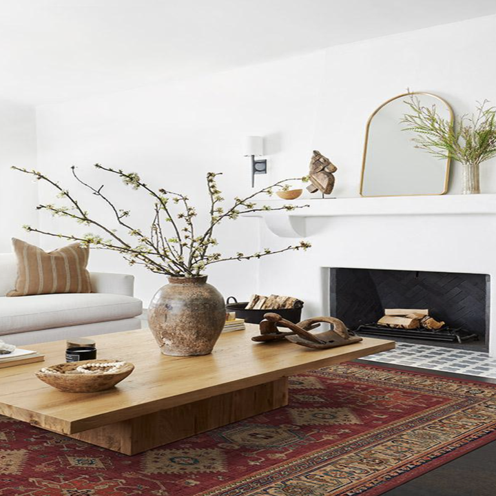 A red and gold rug in a living room