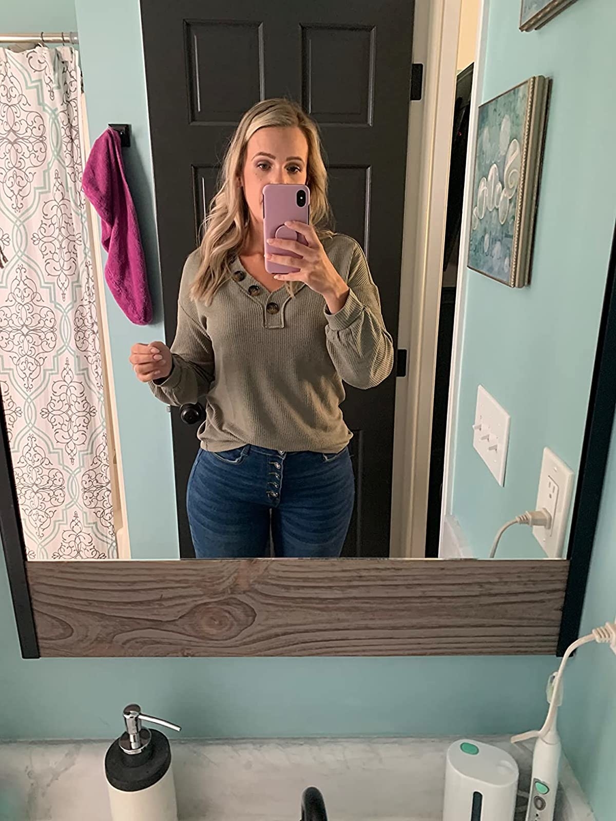 Reviewer wearing brown long sleeve waffle tee with jeans