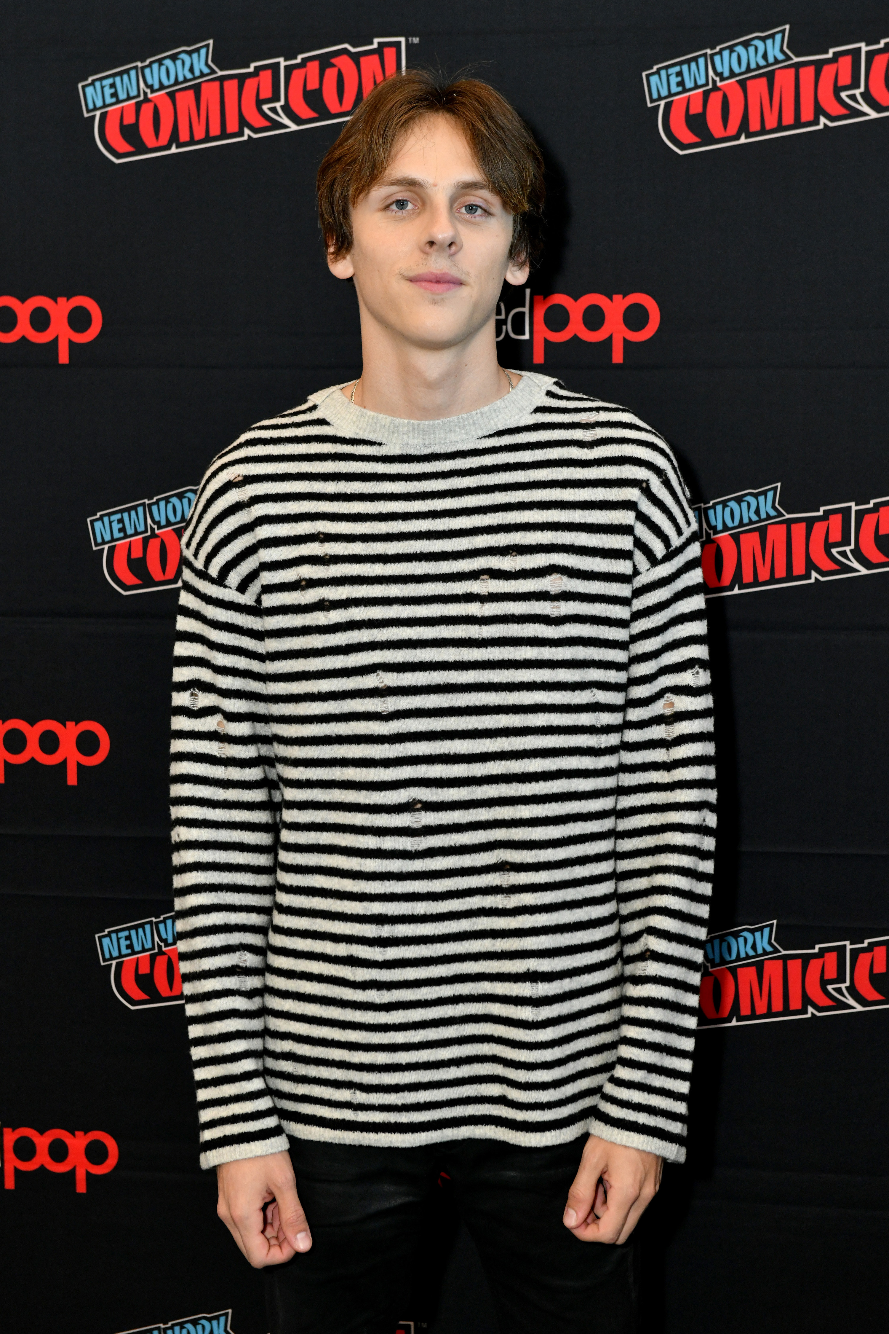 Jacob on the red carpet in a long-sleeved striped shirt