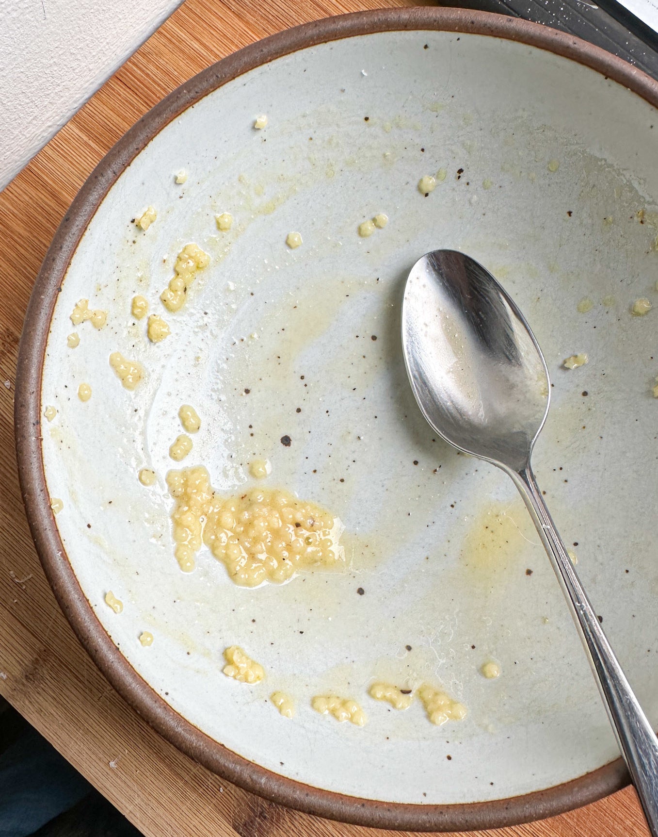 spoon in nearly empty bowl of pastina