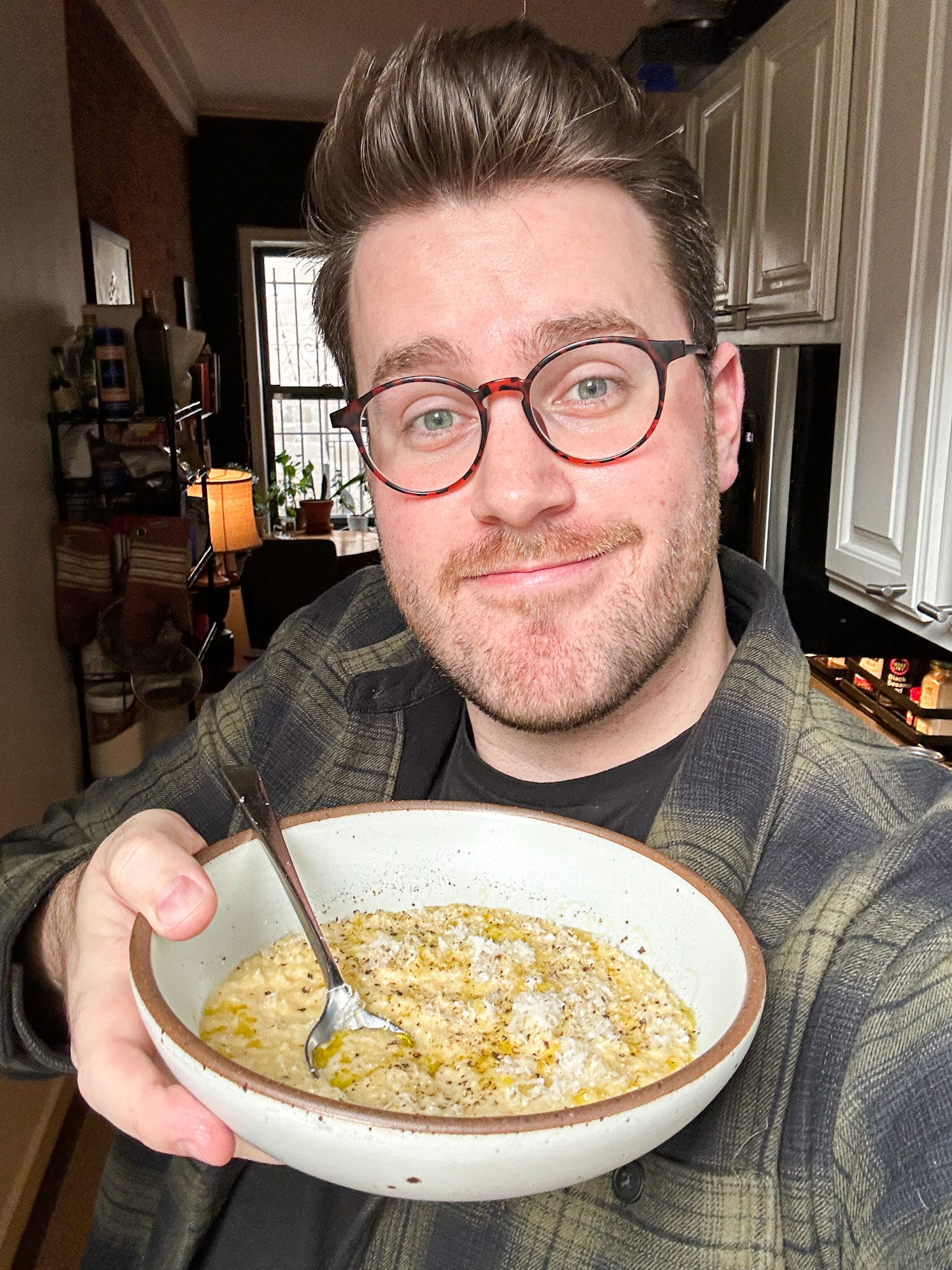 author smiling while holding bowl of pastina