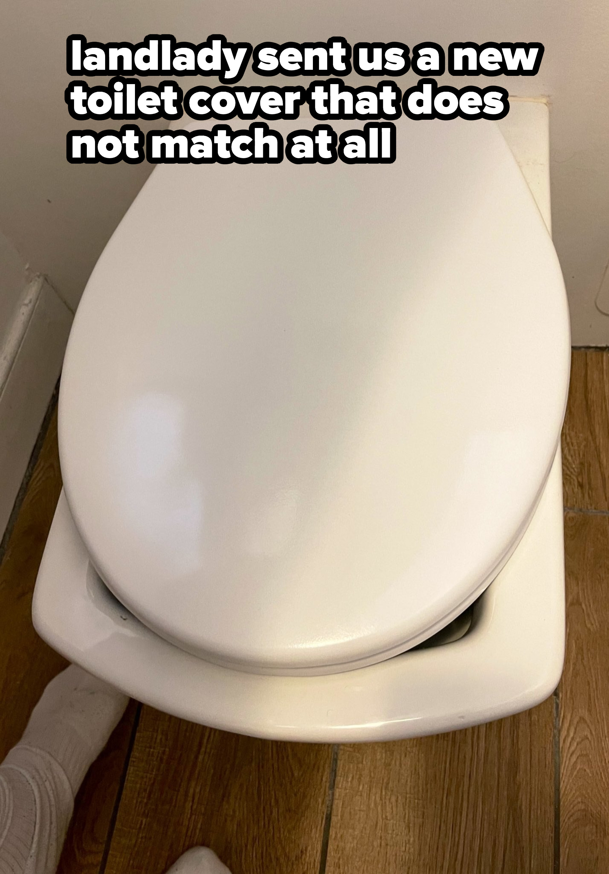 circular toilet seat on a square toilet