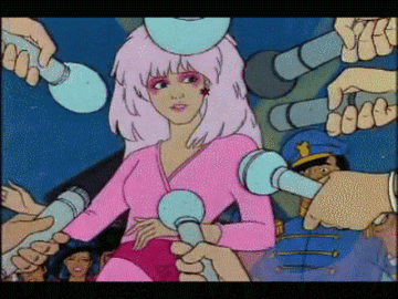 Jem being surrounded by reporters in Jem and the Holograms
