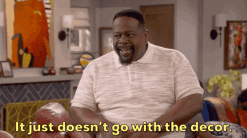 A gif of Cedric the Entertainer in The Neighborhood standing in a living room saying &#x27;It just doesn&#x27;t go with the decor&#x27;