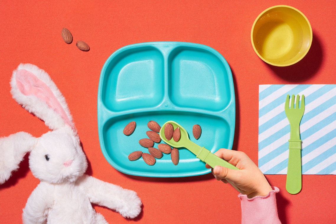 A children&#x27;s lunch tray with almonds on it