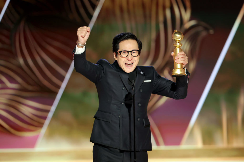 Ke Huy Quan accepts an award onstage at the 80th Annual Golden Globe Awards