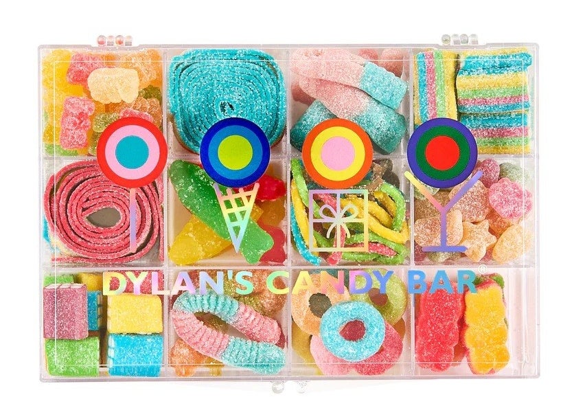 a clear box filled with different types of sour candy