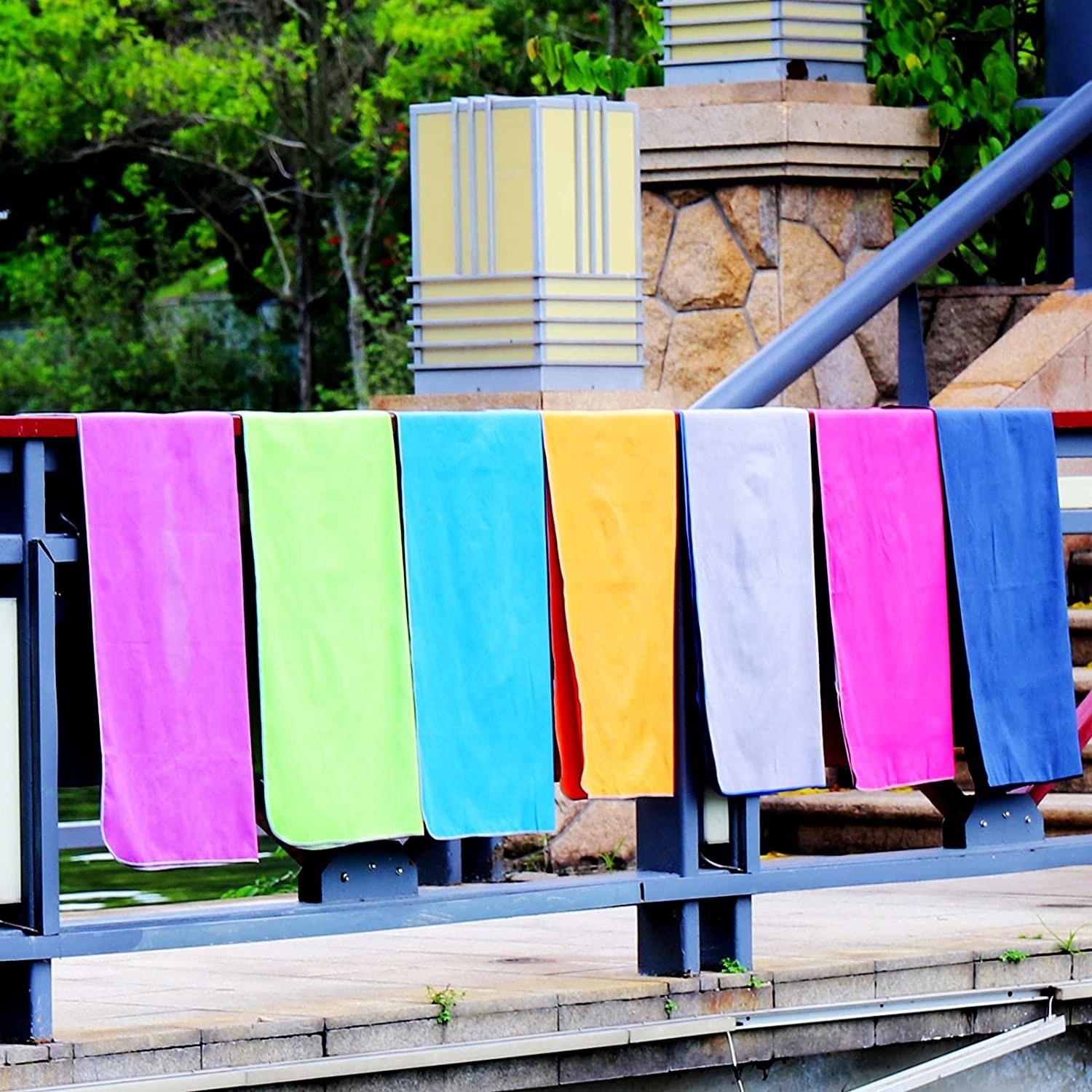 vibrant towels handing off a railing