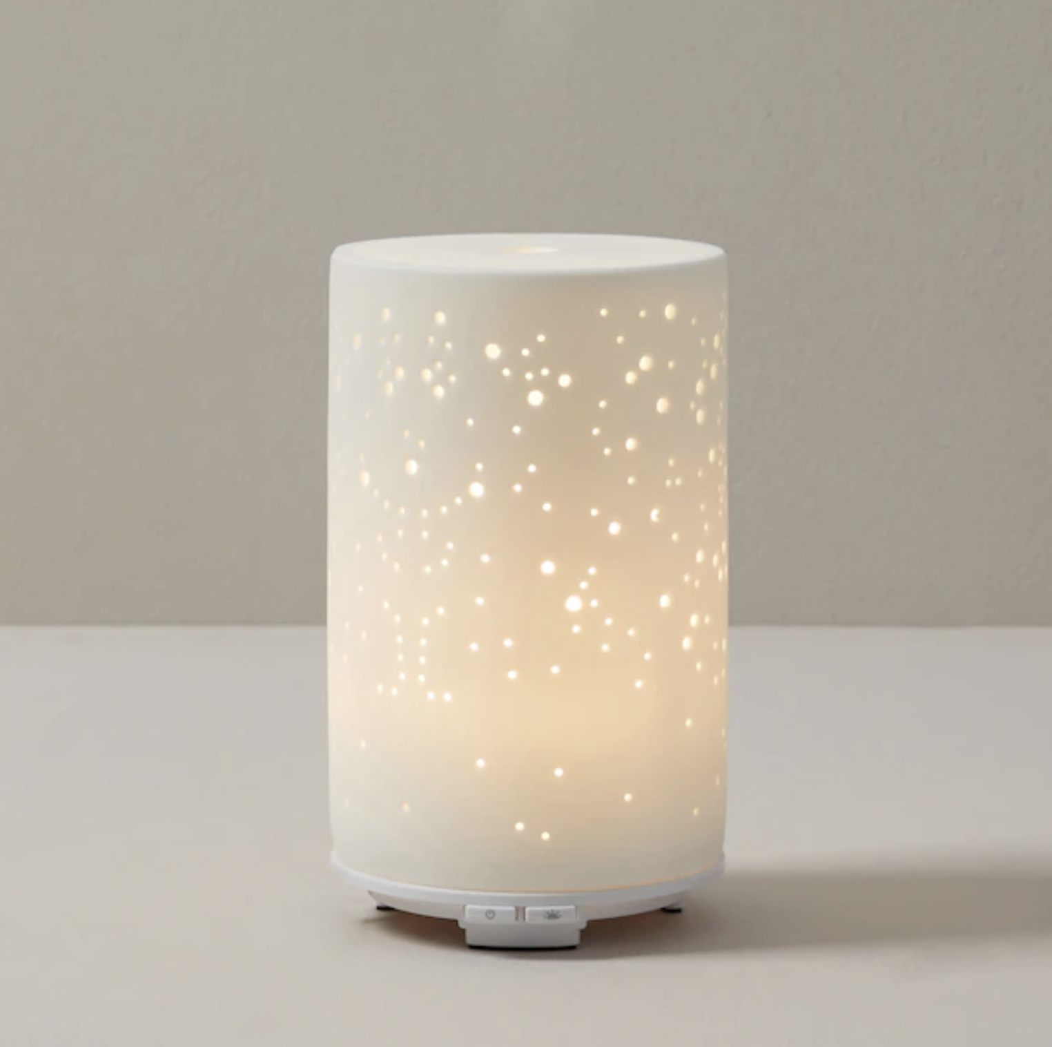 The lit up diffuser on a blank background