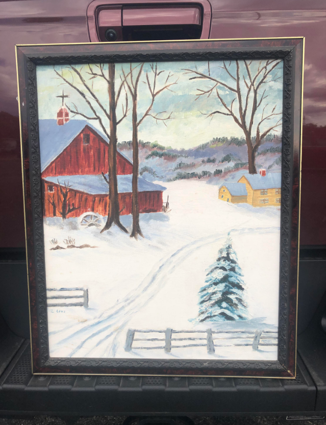framed painting of the countryside covered in snow